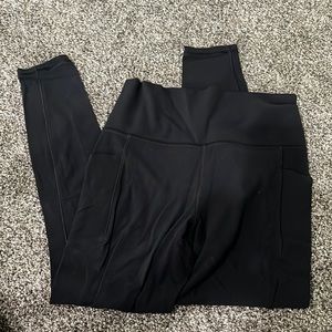 Athleta black salutation stash pocket tight. Size small